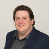 Curtin student, Brendan Crake, looking at camera and smiling