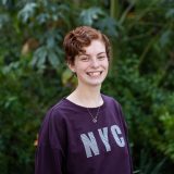 Curtin University student Kayla standing outside smiling at the camera